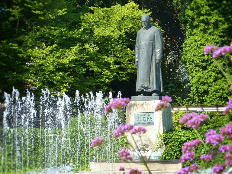 Historical statue of Sebastian Kneipp, pioneer of the history of hydrotherapy and nature cure methods.